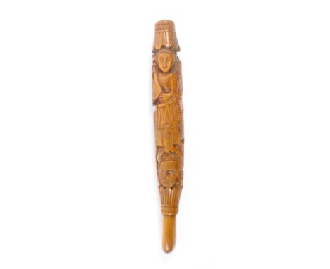 An 18th Century fruitwood short knitting stick carved with a scene of St George slaying the dragon over a zig zag carved grou