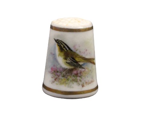 A Royal Worcester puce mark thimble painted with a bird amid flowers between gilt lines and signed W. Powell Internal label S