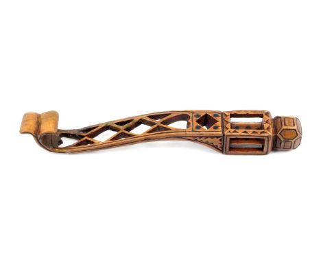A late 18th Century carved and pierced fruitwood knitting stick, Weardale, of scroll form pierced with trellis and hearts bel