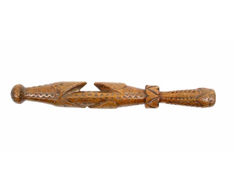 A turned and carved knitting stick, late 18th Century/early 19th Century probably Welsh, the chip carved body with two pairs 