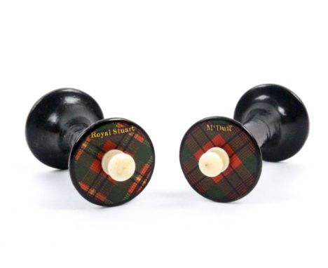 A rare pair of Tartan ware reels (M’Duff and Royal Stuart) waisted ebonised bodies, the titled Tartan tops with central turne