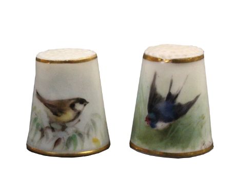 Two Royal Worcester porcelain puce mark thimbles, the first painted with a bird within gilt lines signed Powell, the second s