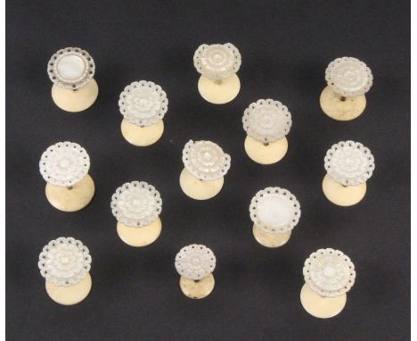 Eleven mother of pearl top reel holders, two detached, and two similar examples with damaged tops, most 3.4cm high          (