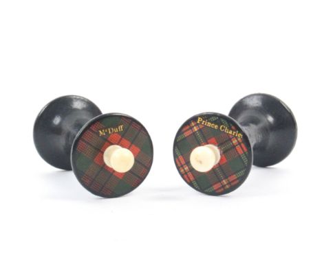 A rare pair of Tartan ware reels, (M’Duff and Prince Charles), the titled Tartan tops with central bone finial, 4.2cm high   