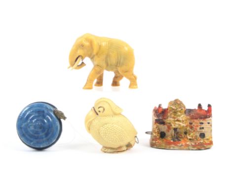 Four novelty tape measures, three in celluloid, comprising a coiled snake, a toucan type bird, both with complete tapes, an e