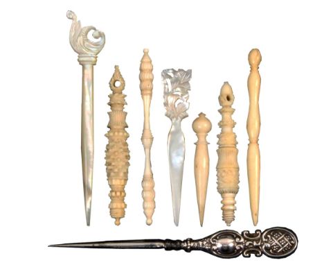 Eight stilettos comprising three turned and carved ivory reversible examples, two turned ivory examples, two mother of pearl 