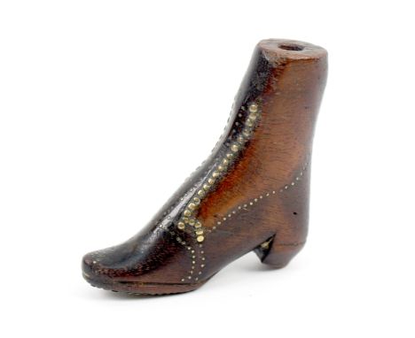 A rare wooden 19th Century knitting stick in the form of a lady’s boot, brass pin decoration, the sole initialled in brass pi