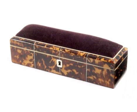 A tortoiseshell sewing box circa, 1840, of rectangular form with pewter line inlay and white metal escutcheon, the lid inset 