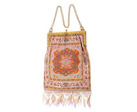 An early 20th Century Lady’s beadwork dress bag, each side in fine coloured beadwork in the Paisley style with central geomet