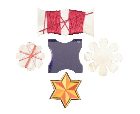 Five silk winders comprising a blue glass example with inward curving sides, 4.5cm square, a split straw work star form examp