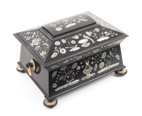 A fine sarcophogal form ebony and cut pearl inlaid sewing box, circa 1860, the angled front and lid inlaid in cut mother of p