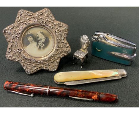 Silver - an Edwardian silver bladed folding fruit knife, Sheffield 1904; miniature chair, London  1903;  embossed eight point