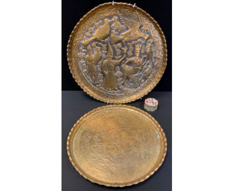 A Persian circular brass tray, embossed with stylised figures and birds, 44cm diam;  another, smaller;  a 19th Cantonese enam