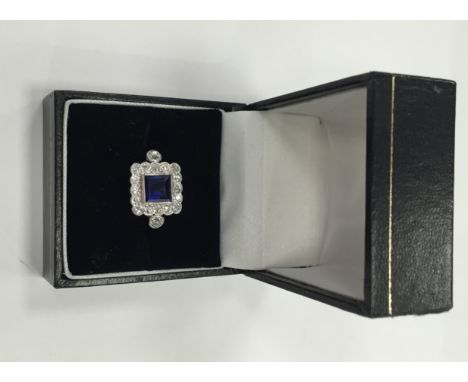 ART DECO SAPPHIRE AND DIAMOND CLUSTER RING
the square sapphire approximately 1.64 carats, surrounded by diamonds totalling ap