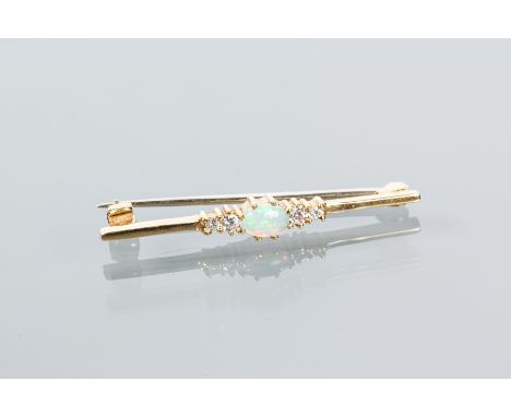 EIGHTEEN CARAT GOLD OPAL AND DIAMOND BAR BROOCH
set centrally with an oval cabochon opal, flanked by brilliant cut diamonds, 