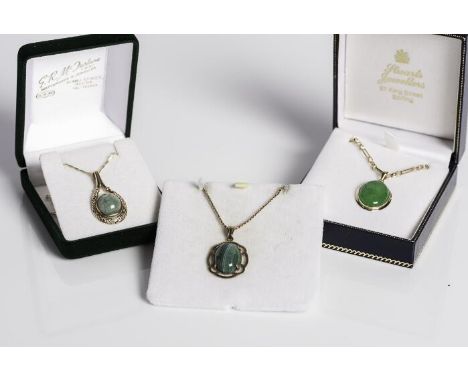 COLLECTION OF THREE GREEN GEM SET PENDANTS
comprising of two jade pendants and a green agate pendant, one jade pendant in fou