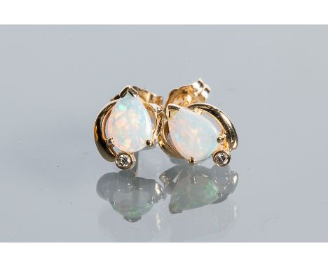 PAIR OF OPAL AND DIAMOND STUD EARRINGS
each set with a pear shaped cabochon cut opal and a small brilliant cut diamond, marke