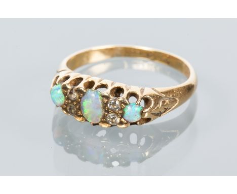 OPAL AND DIAMOND RING
set with three oval opals interspersed with round diamonds, hallmarked for eighteen carat gold, size J