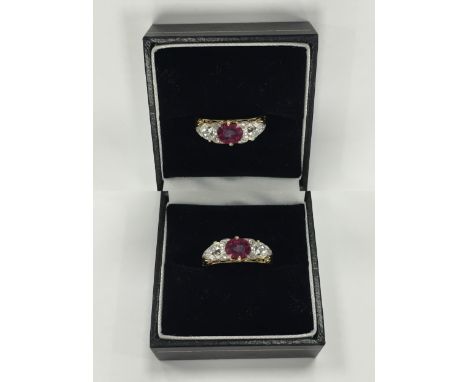 VICTORIAN RUBY AND DIAMOND RING
the central oval ruby approximately 1.15 carats, flanked by two large old cut diamonds, and s