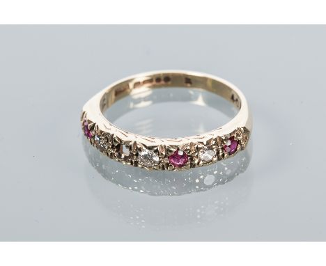 RUBY AND DIAMOND HALF ETERNITY RING
with alternating rubies and diamonds, hallmarked for nine carat gold, size M-N, note: one