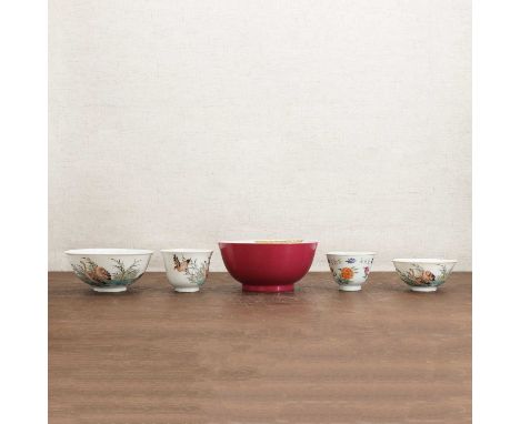 A collection of three Chinese famille rose bowls,20th century, each painted with geese amongst weeds, the centre with peaches