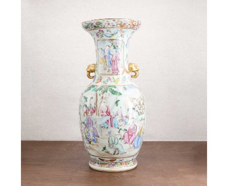 A Chinese Canton famille rose vase,19th century, of baluster form with an inverted rim flanked by two mask and tongue handles