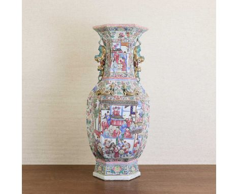 A large Chinese Canton famille rose vase,19th century, of hexagonal form applied with Buddhist lion handles to the neck and c