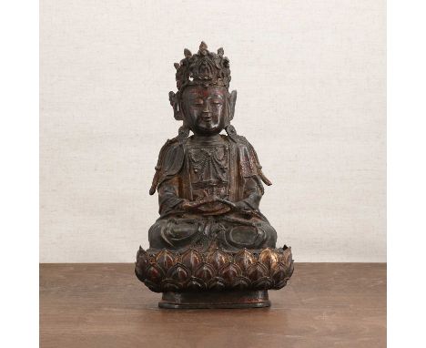 A Chinese gilt-lacquered bronze bodhisattva,late Ming/early Qing dynasty, wearing an elaborate headdress, seated cross-legged