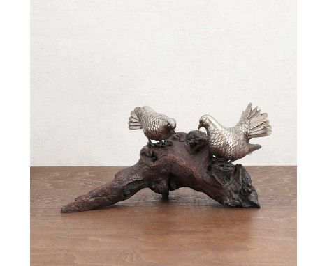 A Japanese okimono,Meiji period (1868-1912), of two bronze doves, standing on a root wood branch, 28cm longCondition ReportOn