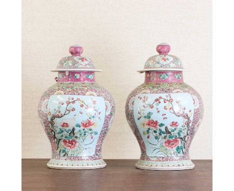 A pair of Chinese famille rose vases and covers,Republic period (1912-1949), each of baluster form, painted with a pheasant o