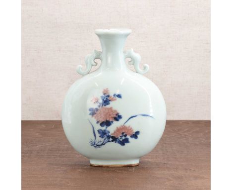 A Chinese copper-red and underglaze-blue moon flask,Qianlong (1736-1795), the compressed circular body rising from an oval fo