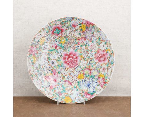 A Chinese famille rose charger,Republic period (1912-1949), of circular form, painted with a millefleurs pattern, a six-chara