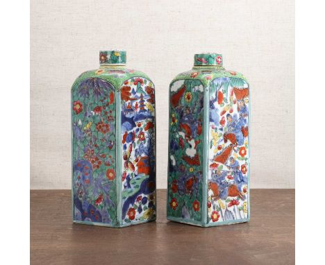 Two Chinese clobbered vases and covers,18th century, each of square form rising to a rounded shoulder with a short neck, pain