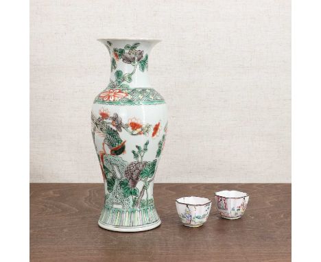 A pair of Chinese Canton enamelled cups,18th century, each of tapering shaped square form, decorated with figures in a garden