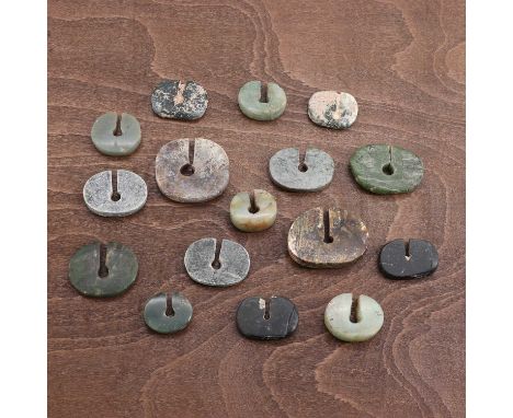 A collection of Chinese jade pendants,Neolithic period (c.6500-1700 BC), each in the 'C' form, plain,2.4 to 4.2cm long (16)Pr