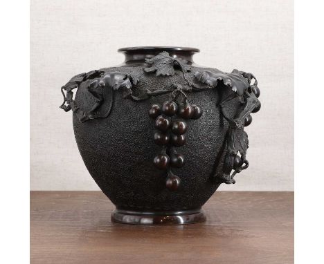A Japanese bronze jar,Meiji period (1868-1912), of ovoid form, decorated with a fruiting vine and grapes in relief, with a tw