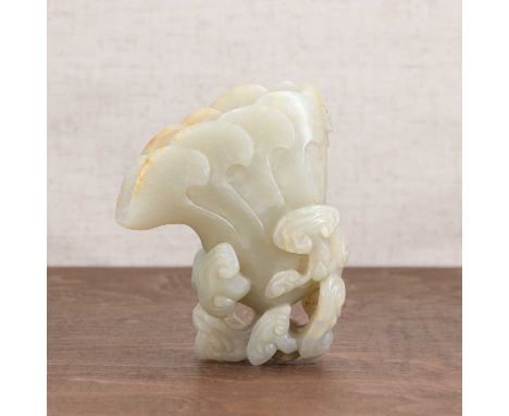 A Chinese jade carving,20th century, in the shape of a cup supported by lingzhi,11.5cm highCondition ReportCracks in various 