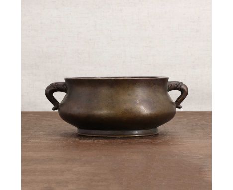 A Chinese bronze incense burner,the compressed globular body rising from a short spreading foot to an everted rim, set at the