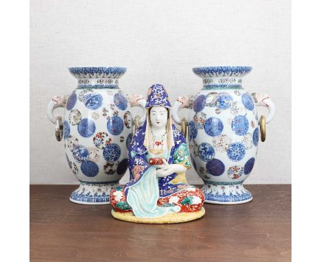 A pair of Japanese Arita vases,Meiji period (1868-1912), each ovoid body rising from a circular foot to an inverted rim, pain