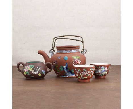 A collection of Chinese Yixing stoneware,Republic period (1912-1949), comprising a teapot and cover, two cups and a sugar bow