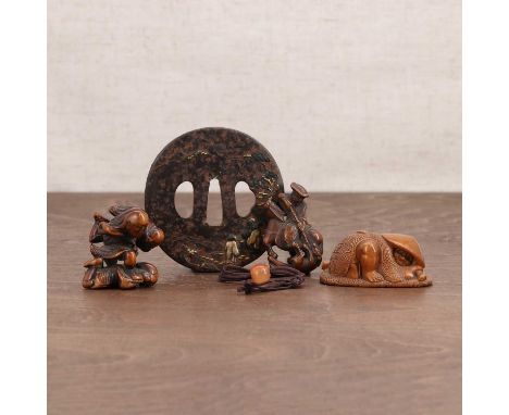 A Japanese bronze tsuba,Meiji period (1868-1912), of oval form, decorated in relief with literati under a pine tree by a clif