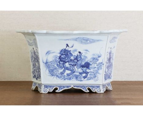 A Chinese blue and white jardinière,Qing dynasty (1644-1911), of hexagonal form, rising from bracket scroll feet to an everte