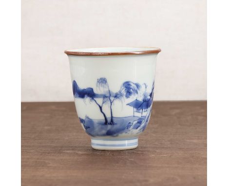 A Chinese blue and white cup,Kangxi (1662-1722), the bell-shaped body rising from a circular foot to an everted rim, painted 