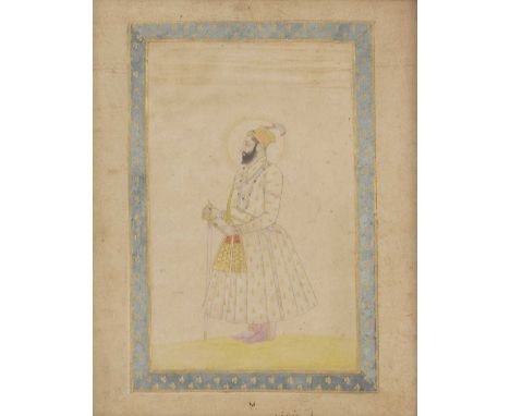 A standing portrait of Mughal emperor Shah 'Alam,c.17th century, holding a talwar in his right hand, adorned with ornate jewe