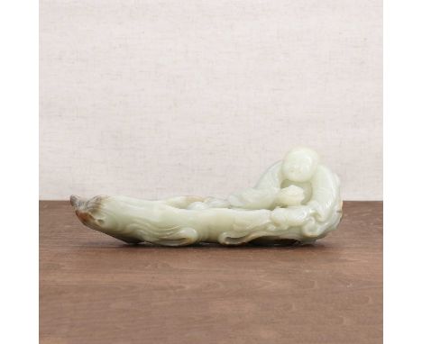 A Chinese jade carving,20th century, of Liu Hai seated in a boat, together with a three-legged toad, a double gourd by his si