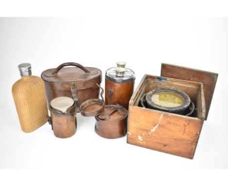 A collection of early 20th century travel equipment, to include a boxed gimbal ship's compass by Sestrel, a leather cased dou