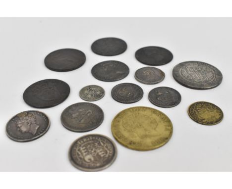 A collection of 18th century and later British coinage to include a 1709 Queen Anne 'Third Bust' shilling, a gilt 1818 King G