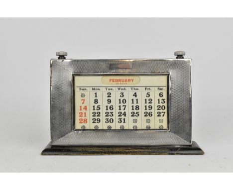 A George V silver-mounted desktop calendar by W.J Myatt &amp; Co, Birmingham 1928, complete with original date and month card