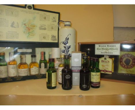 A collection of 14 whisky and two port miniatures and delph flask 