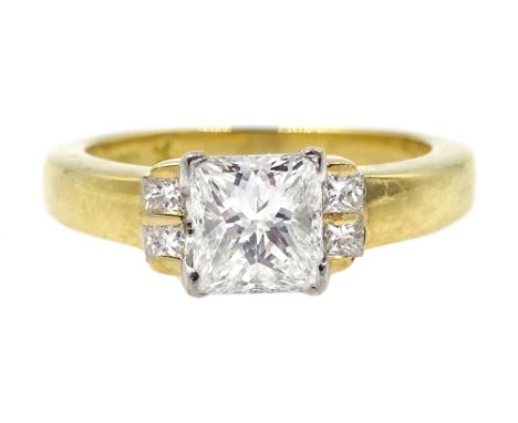 18ct gold princess cut diamond ring, the central diamond of approx 0.80 with two diamonds on either side by Hugh Rice, hallma